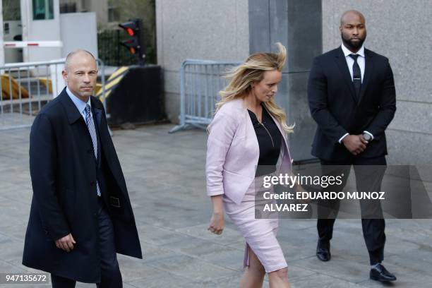 Adult-film actress Stephanie Clifford, also known as Stormy Daniels exits the US Federal Court with her lawyer Michael Avenatti on April 16 in Lower...