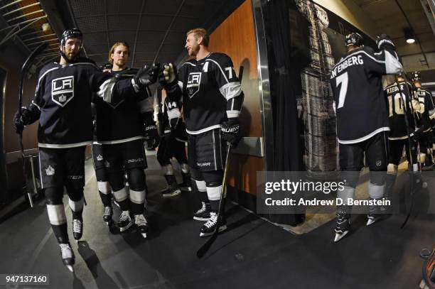 Michael Amadio, Adrian Kempe, and Jeff Carter of the Los Angeles Kings prepare to take the ice before a game against the Vegas Golden Knights in Game...