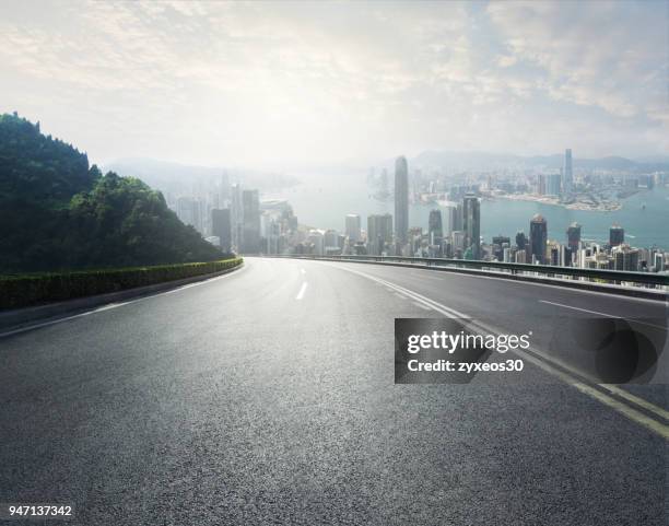 hong kong victoria harbour,east asia,cityscape and mountain road. - hong kong mountain stock pictures, royalty-free photos & images