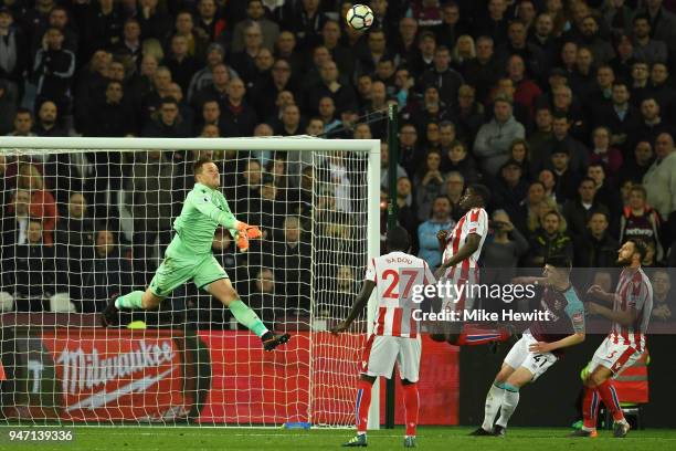 Jack Butland of Stoke City makes a save from Declan Rice of West Ham United during the Premier League match between West Ham United and Stoke City at...