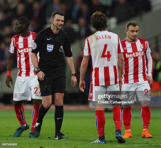Referee Michael Oliver looks on during the Premier League match between West Ham United and Stoke City at London Stadium on April 16, 2018 in London,...