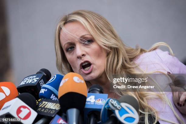 Adult film actress Stormy Daniels speaks to reporters as she exits the United States District Court Southern District of New York for a hearing...