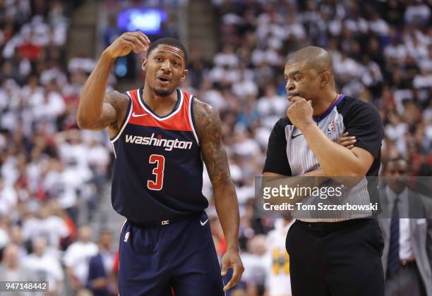 Bradley Beal of the Washington Wizards talks to NBA official Tony Brothers against the Toronto Raptors during Game One of the first round of the 2018...