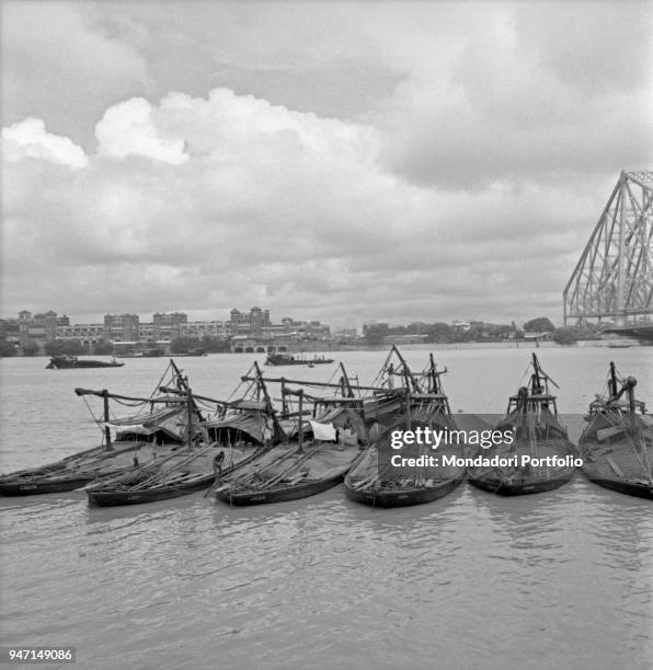 Some boats anchored in the Hooghly river near the Howrah Bridge. Kolkata, 1962