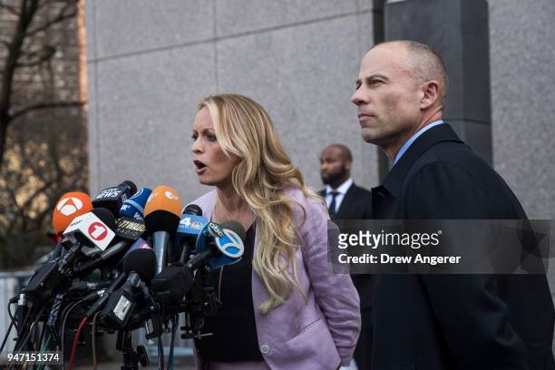 Adult film actress Stormy Daniels and Michael Avenatti, attorney for Stormy Daniels, speak to the media as they exit the United States District Court...