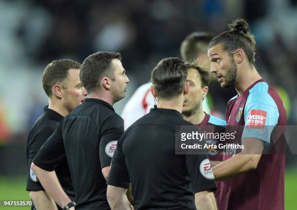 Andy Carroll of West Ham United disagrees with referee Michael Oliver during the Premier League match between West Ham United and Stoke City at...