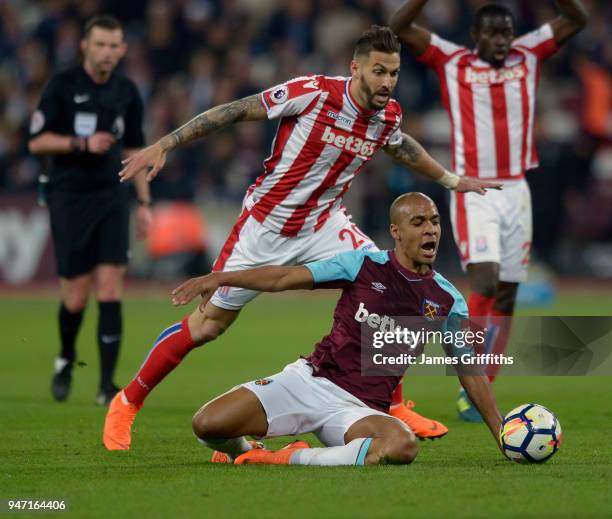 Joao Mario of West Ham United in action with Geoff Cameron of Stoke City during the Premier League match between West Ham United and Stoke City at...