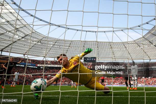 Julian Brandt of Bayer Leverkusen scores his teams first goal past goalkeeper Lukas Hradecky of Eintracht Frankfurt during the Bundesliga match...