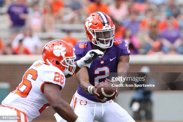 Adam Choice takes a hand off from Kelly Bryant during action in the Clemson Spring Football game at Clemson Memorial Stadium on April 14, 2018 in...