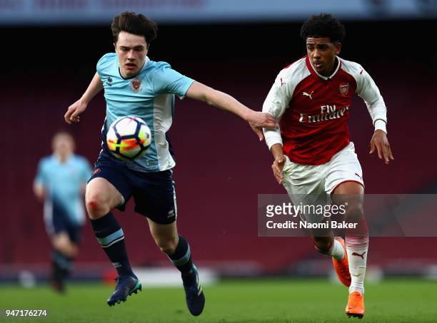Tom Williams of Blackpool and Xavier Amaechi of Arsenal battle for possesion during the FA Youth Cup Semi Final 2nd Leg match between Arsenal and...