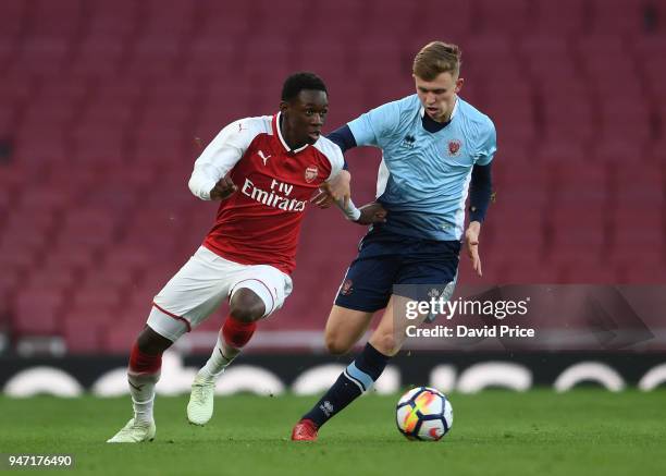 Flo Balogun of Arsenal takes on Rowan Roache of Blackpool resulting in a penalty during the match between Arsenal and Blackpool at Emirates Stadium...