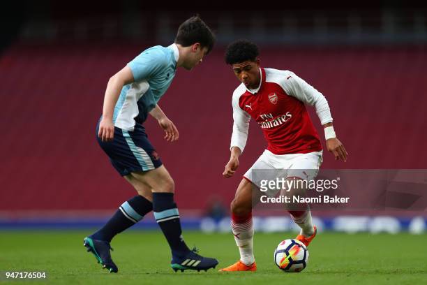 Tom Williams of Blackpool and Xavier Amaechi of Arsenal battle for possesion during the FA Youth Cup Semi Final 2nd Leg match between Arsenal and...