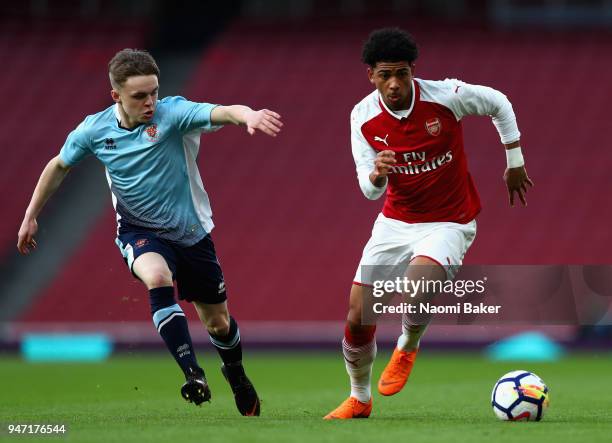 Tom Williams of Blackpool and Xavier Amaechi of Arsenal battle for possesion during the FA Youth Cup Semi Final 2nd Leg match between Arsenal and...