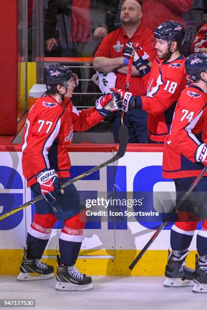 Washington Capitals right wing T.J. Oshie is congratulated by center Chandler Stephenson after his third period power play goal tied the game agains...