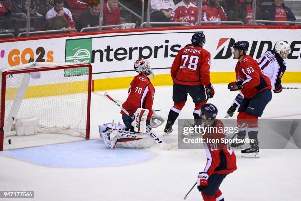 Columbus Blue Jackets left wing Matt Calvert scores the game winning goal in overtime against Washington Capitals goaltender Braden Holtby in action...