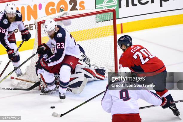 Columbus Blue Jackets defenseman Ian Cole blocks a third period shot by Washington Capitals center Lars Eller on April 15 at the Capital One Arena in...