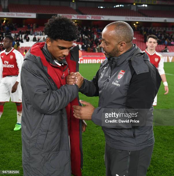 Kwame Ampadu the Manager of Arsenal U18s has a word with Xavier Amaechi after the match between Arsenal and Blackpool at Emirates Stadium on April...