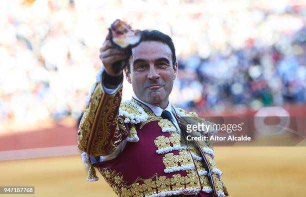 Spanish Bullfighter Enrique Ponce waves to the spectator after cut one ear during the Feria de Abril Bullfight at La Maestranza on April 16, 2018 in...