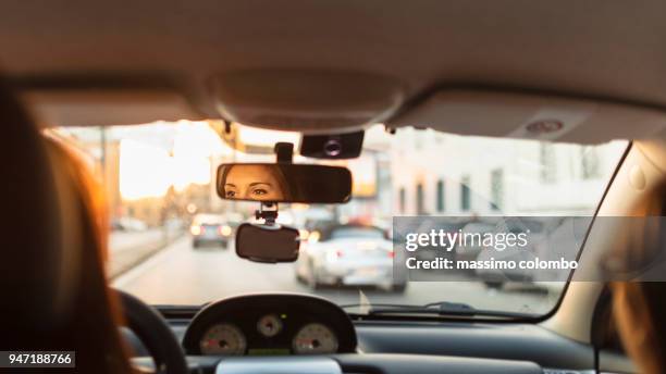 city traffic by car - pendler stock-fotos und bilder