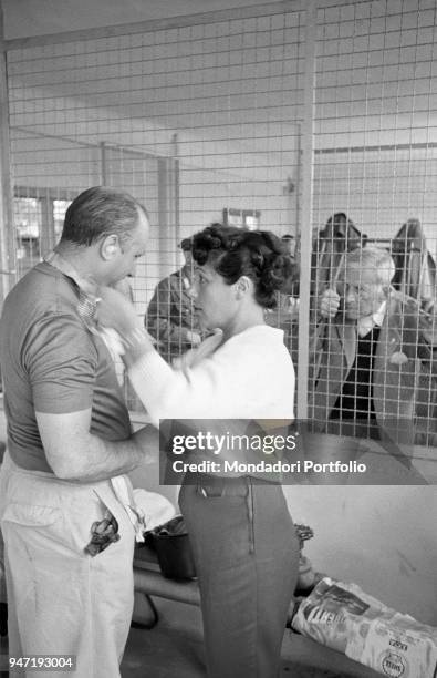 Argentinian car driver Juan Manuel Fangio's wife Andrea Berruet wishing good luck to her husband before the Italian Grand Prix. Monza, 2nd September...