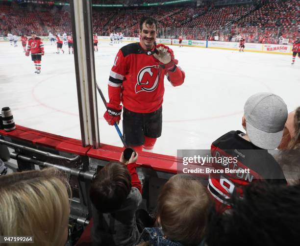 Brian Boyle of the New Jersey Devils skates in warm-ups and waves to his kids prior to the game against the Tampa Bay Lightning in Game Three of the...