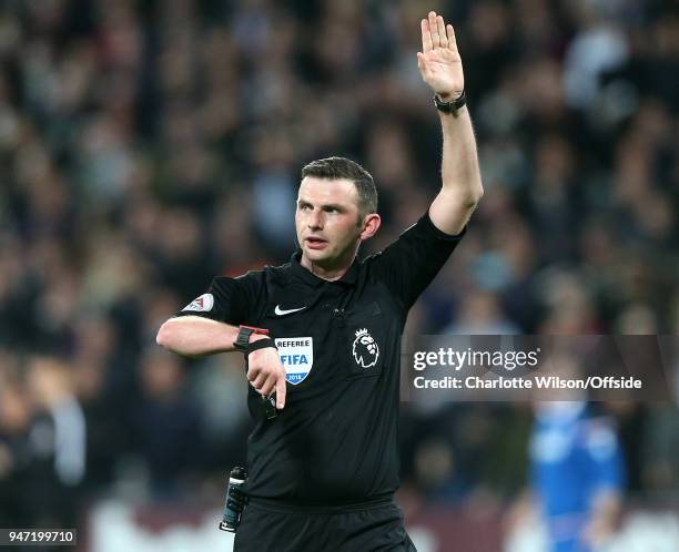 Referee Michael Oliver during the Premier League match between West Ham United and Stoke City at London Stadium on April 16, 2018 in London, England.