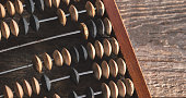 Vintage abacus on wood background
