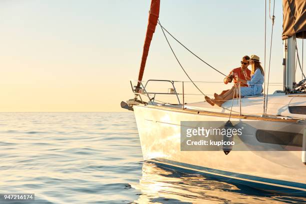 spending their summer at sea - couple celebrating stock pictures, royalty-free photos & images