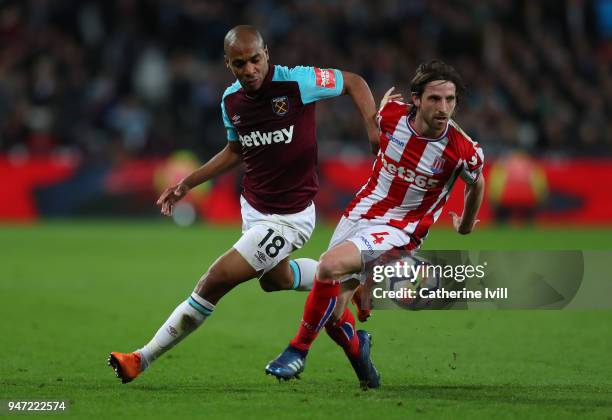 Joao Mario of West Ham United and Joe Allen of Stoke City during the Premier League match between West Ham United and Stoke City at London Stadium on...