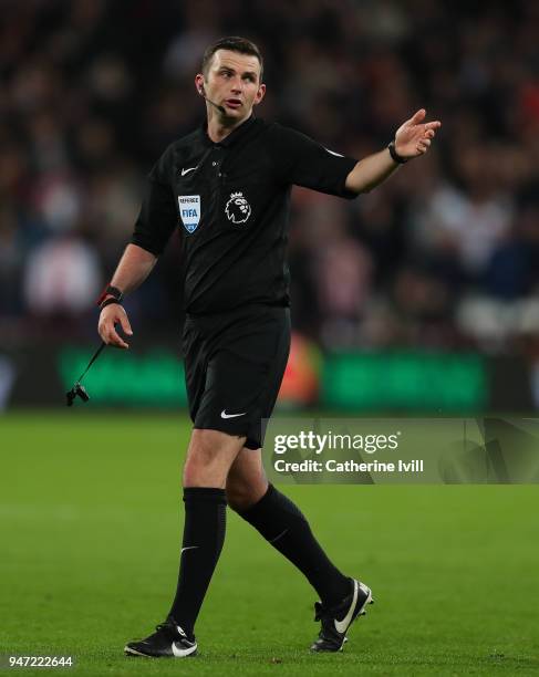 Referee Michael Oliver during the Premier League match between West Ham United and Stoke City at London Stadium on April 16, 2018 in London, England.