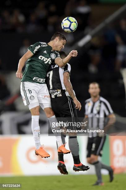 Leandro Carvalho of Botafogo struggles for the ball with Diogo Barbosa of Palmeiras during the match between Botafogo and Palmeiras as part of...