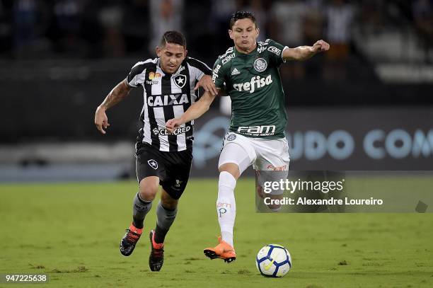 Leandro Carvalho of Botafogo struggles for the ball with Diogo Barbosa of Palmeiras during the match between Botafogo and Palmeiras as part of...