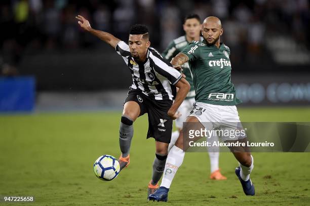 Matheus Fernandes of Botafogo struggles for the ball with Felipe Melo of Palmeiras during the match between Botafogo and Palmeiras as part of...