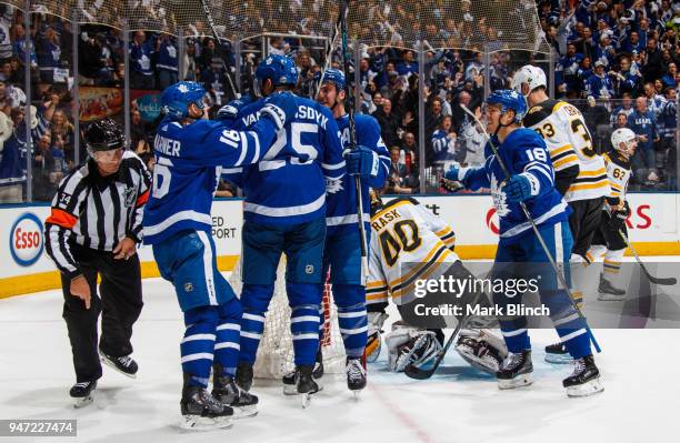 James van Riemsdyk of the Toronto Maple Leafs is congratulated by his teammates Mitch Marner, Tyler Bozak and Andreas Johnsson after scoring on...