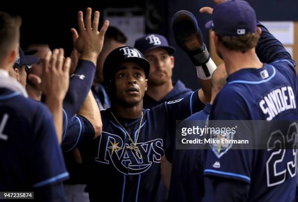 Mallex Smith of the Tampa Bay Rays is congratulated after scoring a run in the second inning during a game against the Texas Rangers at Tropicana...