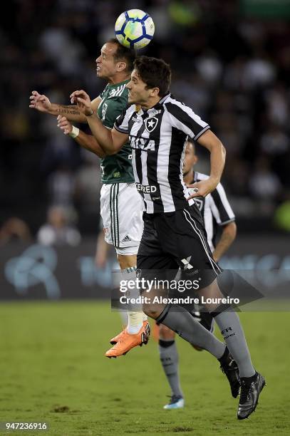 Igor Rabello of Botafogo struggles for the ball with Alejandro Guerra of Palmeiras during the match between Botafogo and Palmeiras as part of...
