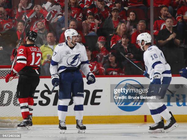 Alex Killorn of the Tampa Bay Lightning celebrates his powerplay goal at 1:42 of the second period against the New Jersey Devils and is joined by...