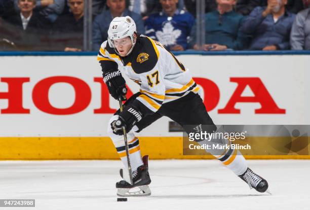 Torey Krug of the Boston Bruins carries the puck against the Toronto Maple Leafs in Game Three of the Eastern Conference First Round during the 2018...