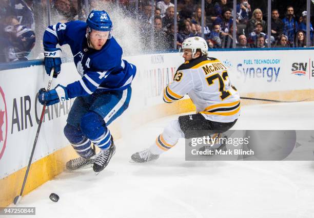 Morgan Rielly of the Toronto Maple Leafs skates against Charlie McAvoy of the Boston Bruins in Game Three of the Eastern Conference First Round...