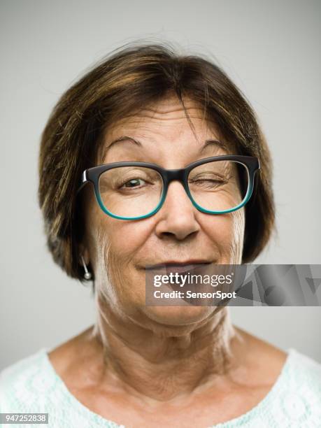 real senior woman portrait winking - blinking stock pictures, royalty-free photos & images