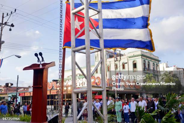 The Cuban flag waves over microphones during a political act commemorating the 57th anniversary of a speech in which Fidel Castro declared the...