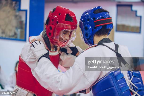 boys taekwondo fight - karate belt stock pictures, royalty-free photos & images