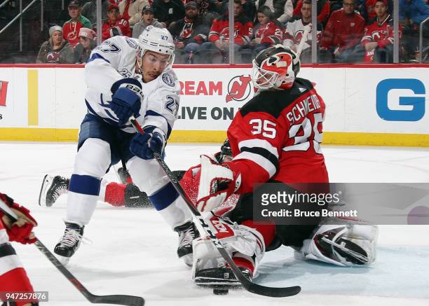 Cory Schneider of the New Jersey Devils makes the third period save on Ryan McDonagh of the Tampa Bay Lightning in Game Three of the Eastern...