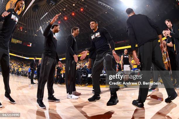Danny Green of the San Antonio Spurs high fives his teammates before the game against the Golden State Warriors in Game Two of Round One of the 2018...