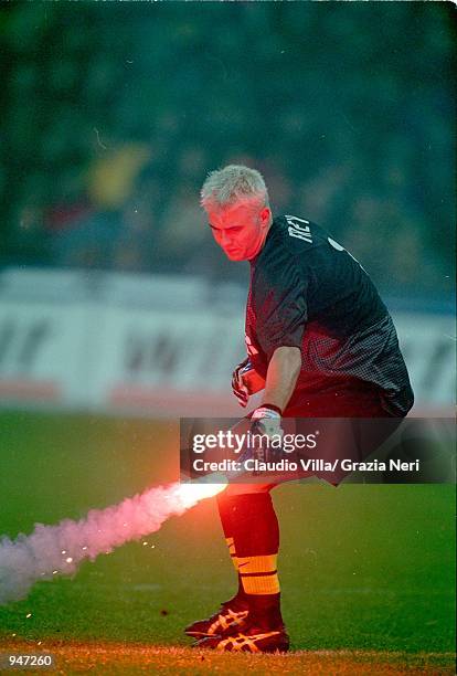 Sebastien Frey of Inter Milan throws a firework off the pitch during the Italian Serie A match against Juventus played at the San Siro, in Milan,...