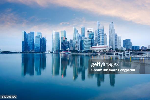 skyline of singapore by the marina bay - singapore stock-fotos und bilder
