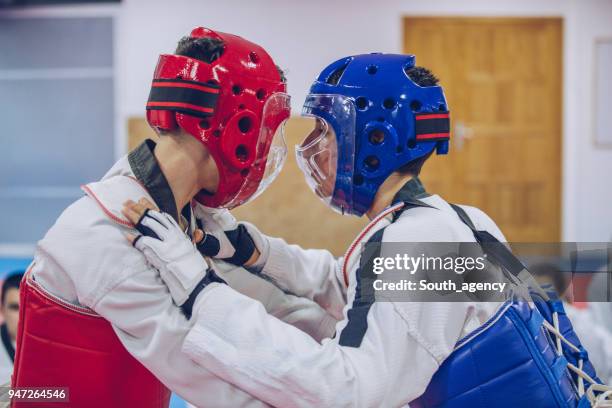 men taekwondo fight - karate belt stock pictures, royalty-free photos & images