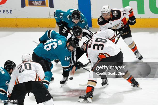 Eric Fehr of the San Jose Sharks and Derek Grant of the Anaheim Ducks faceoff in Game Three of the Western Conference First Round during the 2018 NHL...