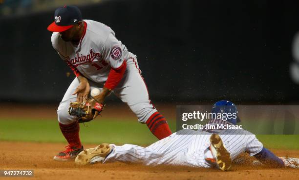 Juan Lagares of the New York Mets beats the throw to Howie Kendrick of the Washington Nationals as he steals second base during the sixth inning at...