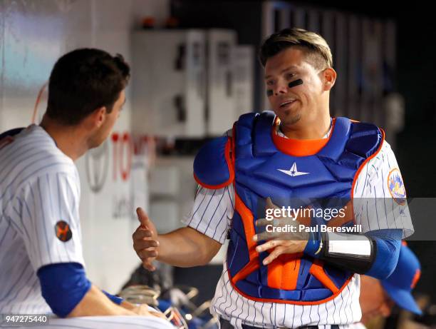Pitcher Steven Matz and catcher Jose Lobaton of the New York Mets talk things over after pitching and catching in the top of the first inning in an...